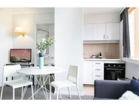 Bright modern studio steps from the action